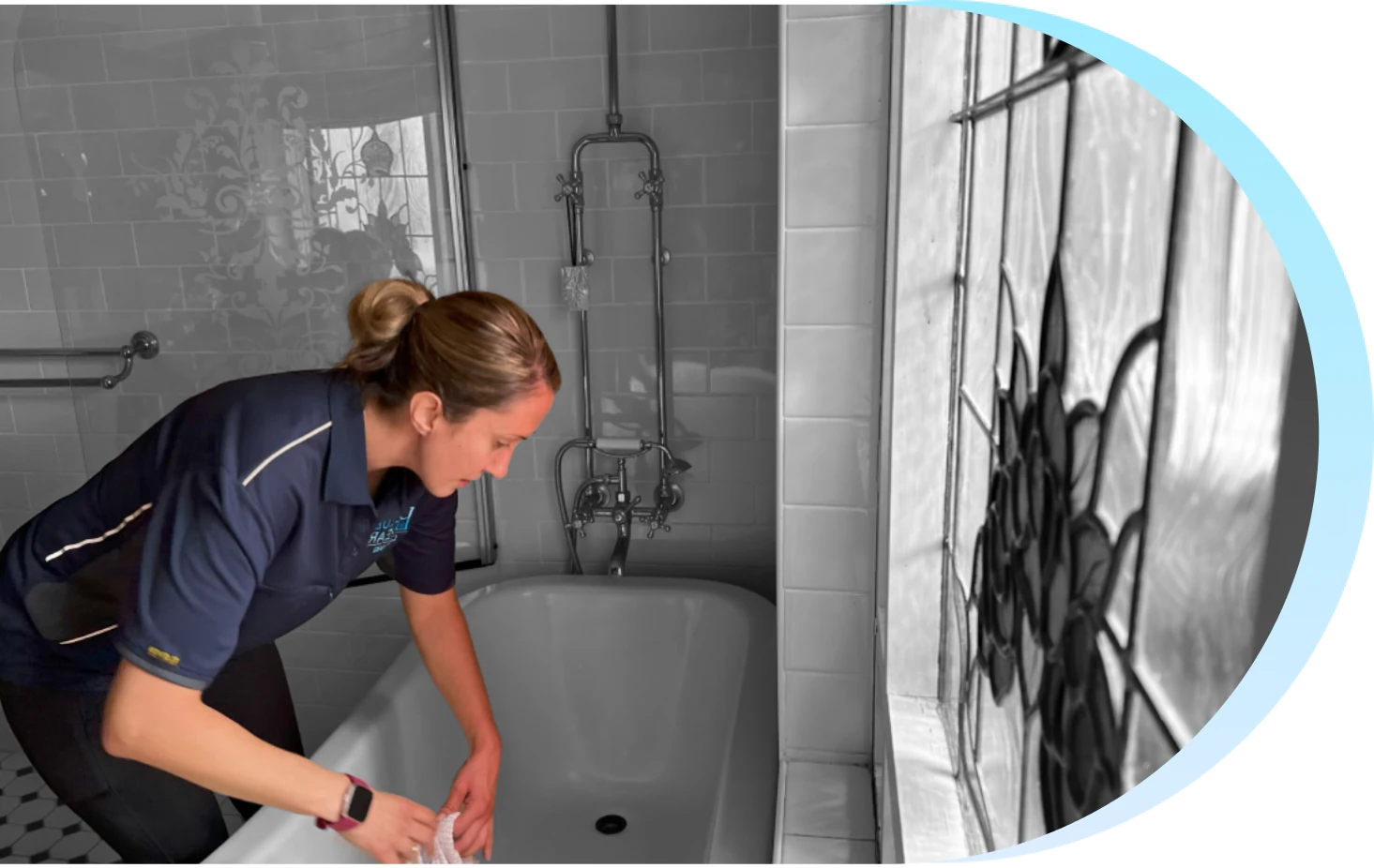 BlueBear Cleaning team member cleaning a bathroom